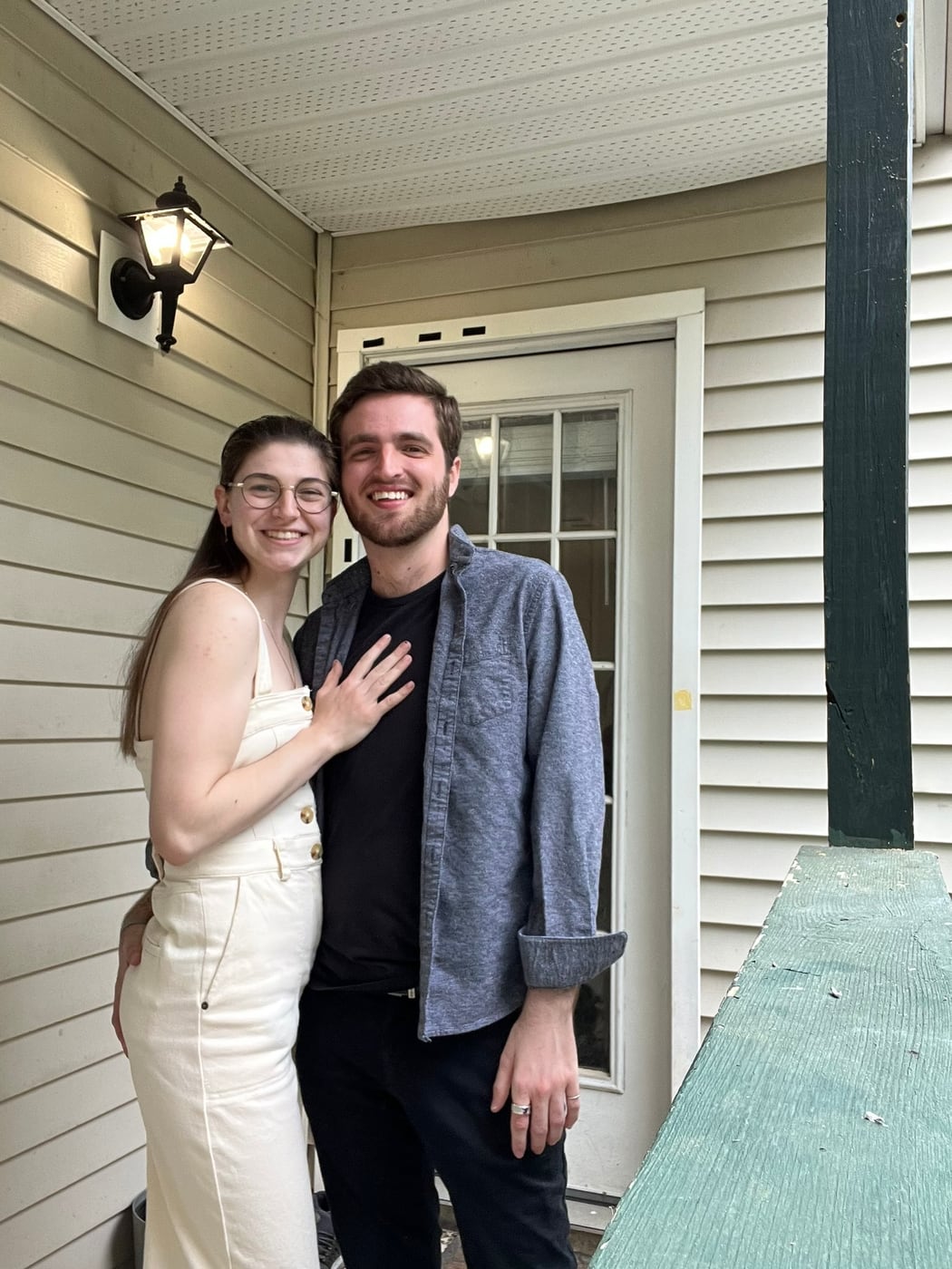 Tylar and Carly on the porch, her hand on his chest