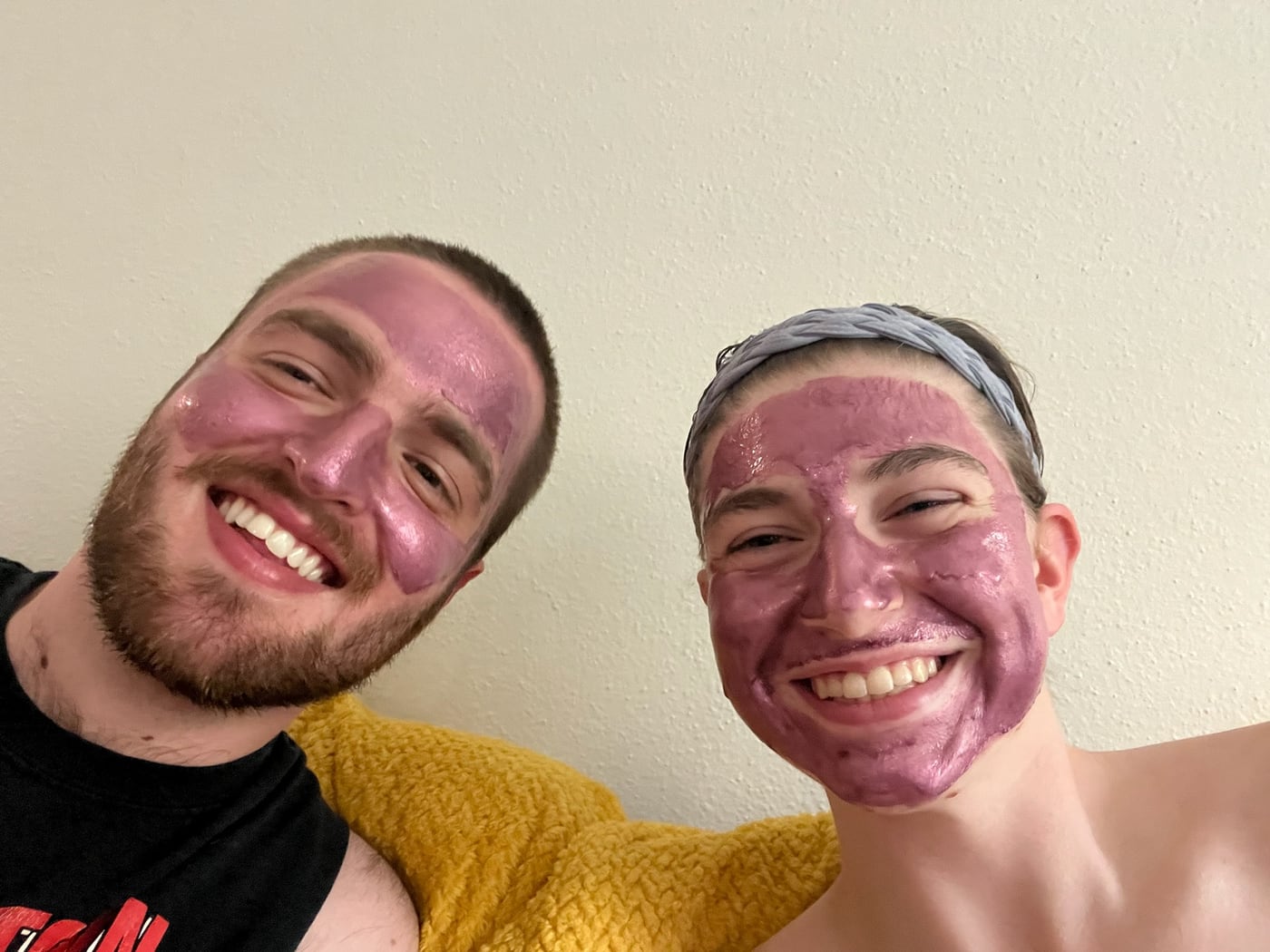 Tylar and Carly in face masks, grinning at the camera
