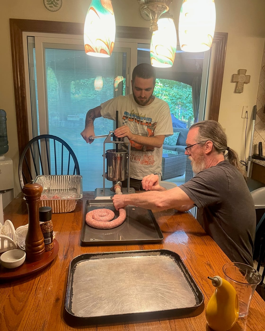Tylar making sausage at the kitchen counter